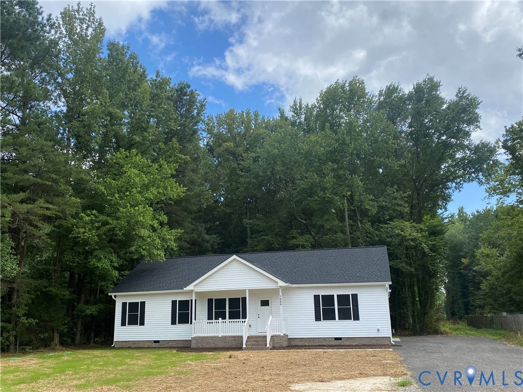 5008 Chestnut Fork Road Gloucester, VA 23061 - Photo 35 of 35 a front view of a house with a garden