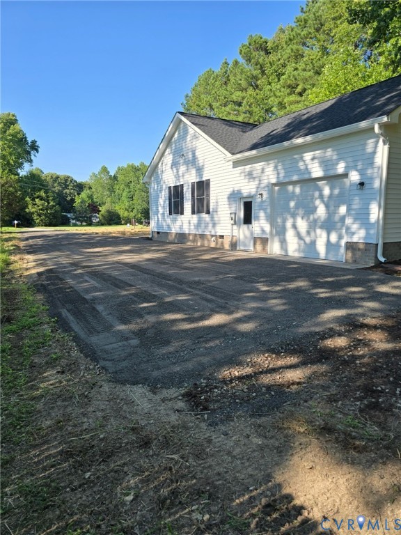 5008 Chestnut Fork Road Gloucester, VA 23061 - Photo 4 of 35 a front view of a house with a yard
