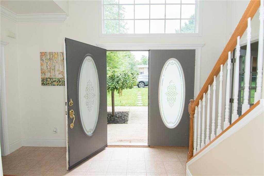 190 Warren Road Warrendale, PA 15086 - Photo 2 of 25 The expansive entryway offers plenty of room to remove shoes and coats and greet guests. The doorway in the photo to the right at the bottom of the stairs leads to the study/den. The doorway to the left opens to the room currently being used as a dining room