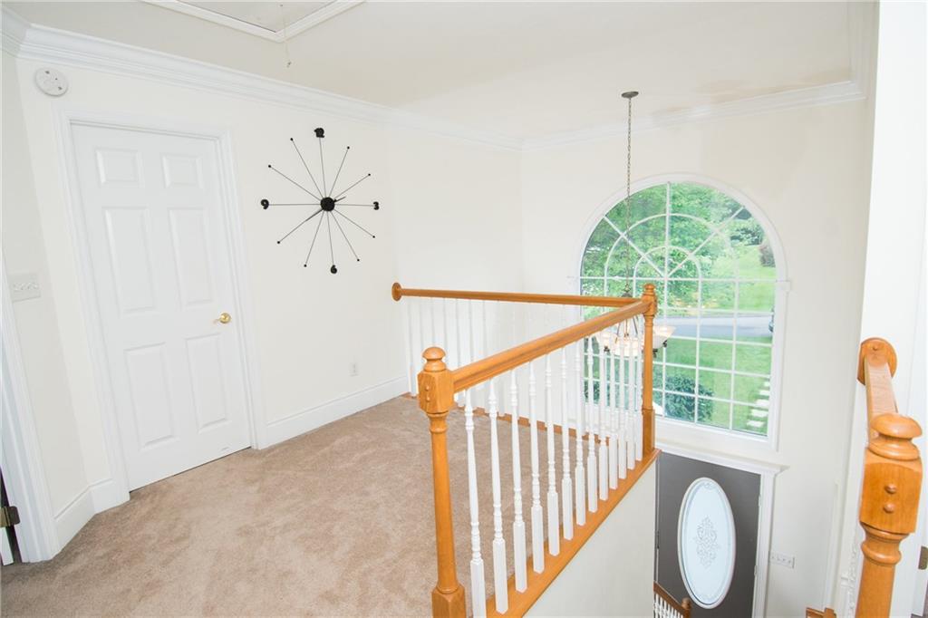 190 Warren Road Warrendale, PA 15086 - Photo 13 of 25 This is a view of the impressive two story foyer as seen from the second floor hallway. The second floor hallway is very spacious and features an alcove that allows for an additional seating area or furniture for more storage options or simply a space that allows for a more open feel.