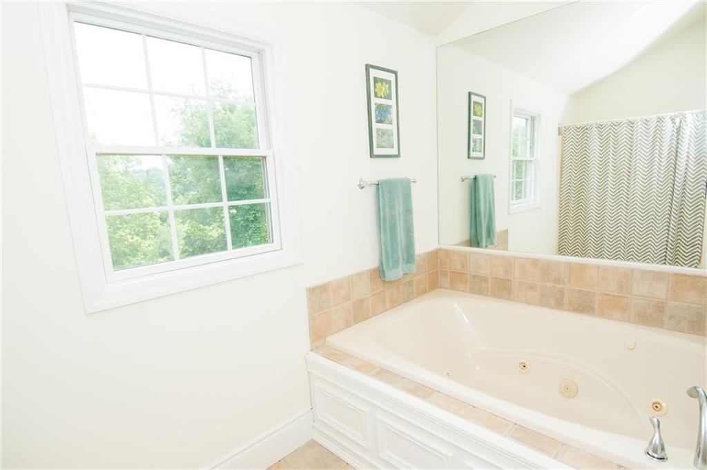 190 Warren Road Warrendale, PA 15086 - Photo 16 of 25 The second room in the master bath is unique in that it offers a jet spray soaking tub as well as a shower/tub combo. Also a bonus is the window that allows in natural light and a view of the beautiful wooded private space in the rear of the home.