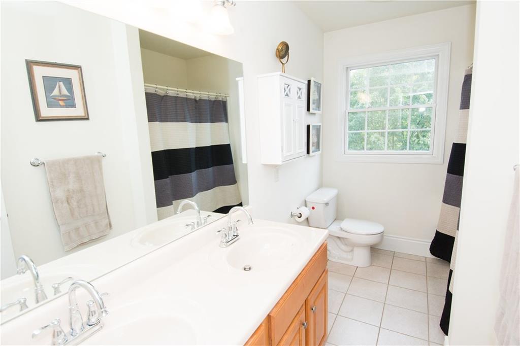190 Warren Road Warrendale, PA 15086 - Photo 20 of 25 The shared hall bath also features double sinks, a large vanity for storage underneath and a window that allows for natural light. Plenty of room in here for multiple people to get ready in the morning!