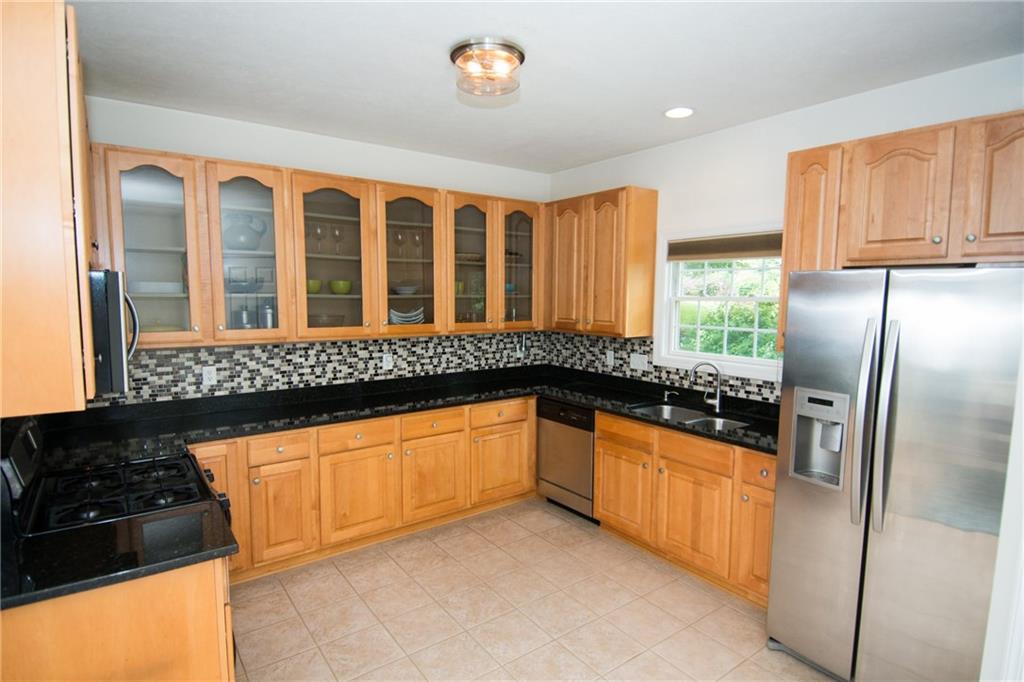 190 Warren Road Warrendale, PA 15086 - Photo 3 of 25 The spacious kitchen offers an enormous amount of prep space as well as the potential for an island to be added in the center. New granite, back splash and light fixture are new additions to this fantastic space!