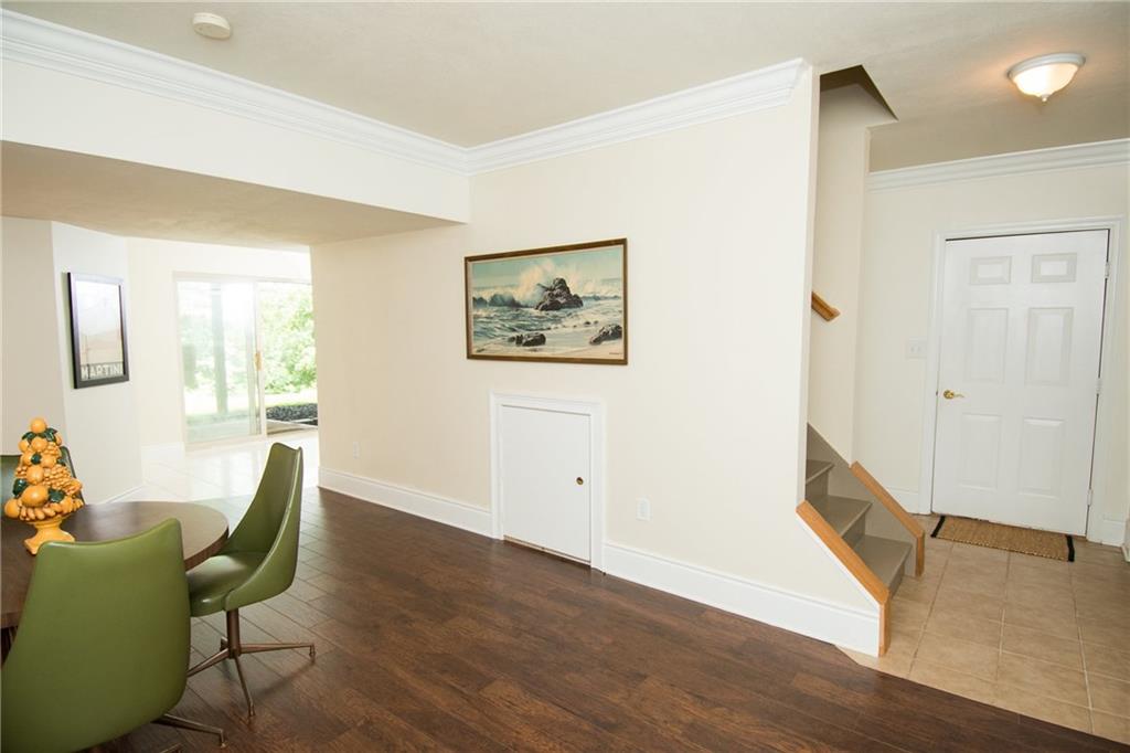 190 Warren Road Warrendale, PA 15086 - Photo 22 of 25 Another view of the finished game room shows the area leading to the garage. This area is a great stopping point for shoes, coats, sports, school and work gear. This home offers abundant storage and living space.