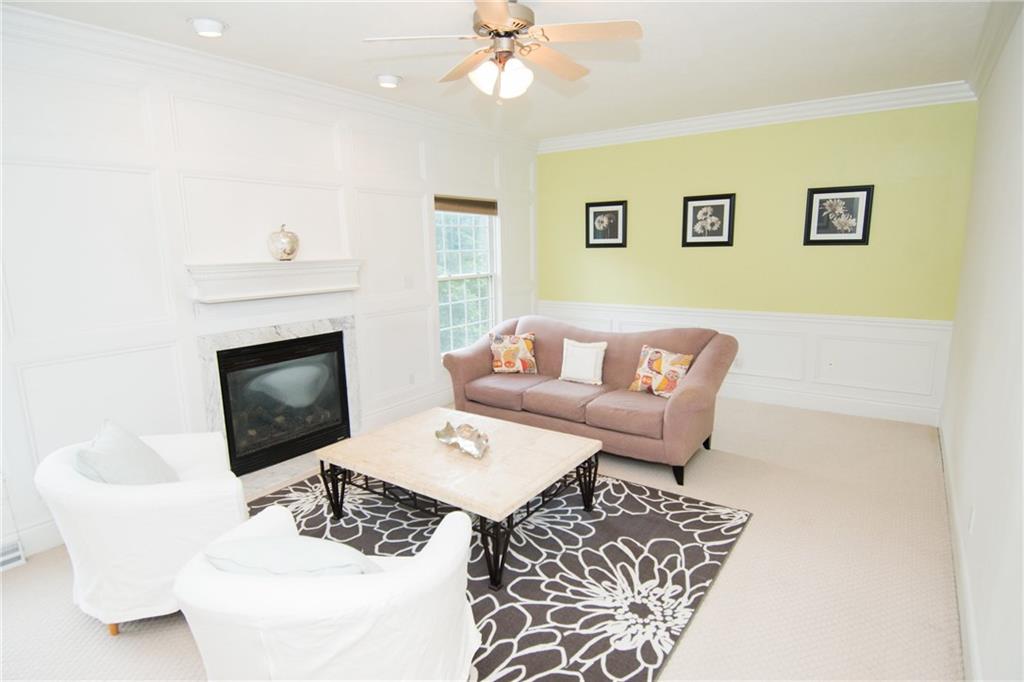 190 Warren Road Warrendale, PA 15086 - Photo 9 of 25 What a great place to relax! Gas fireplace, two large windows overlooking the serene, back yard setting and abundant space that allows for creativity and change in furniture layout. The back wall with half wainscoting and crown molding offer an alternative visually appealing view to the room.
