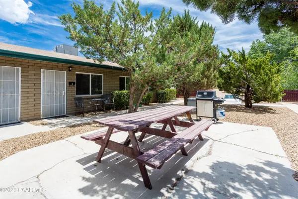 a view of a backyard with sitting area