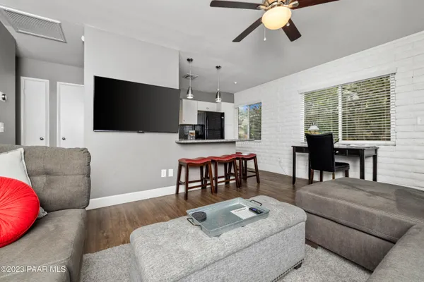 a kitchen with stainless steel appliances granite countertop a stove top oven a sink and cabinets