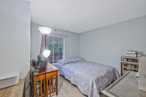 a bedroom with a bed and dresser