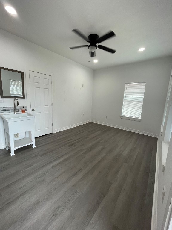 2302 Avenue H, Unit 14 Rosenberg, TX 77471 - Photo 1 of 15 a view of a livingroom with a hardwood floor and a ceiling fan