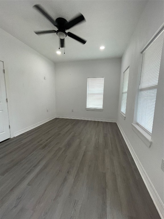 2302 Avenue H, Unit 14 Rosenberg, TX 77471 - Photo 5 of 15 wooden floor in an empty room with a window