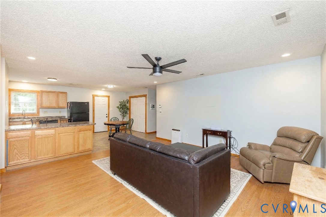 460 Horseshoe Road Jarratt, VA 23867 - Photo 5 of 24 a living room with furniture and a large window