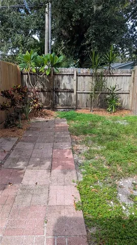 a backyard of a house with lots of green space