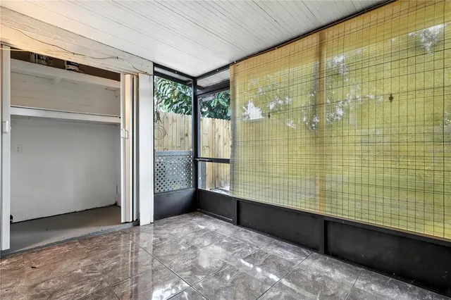 a view of a house with backyard and trees