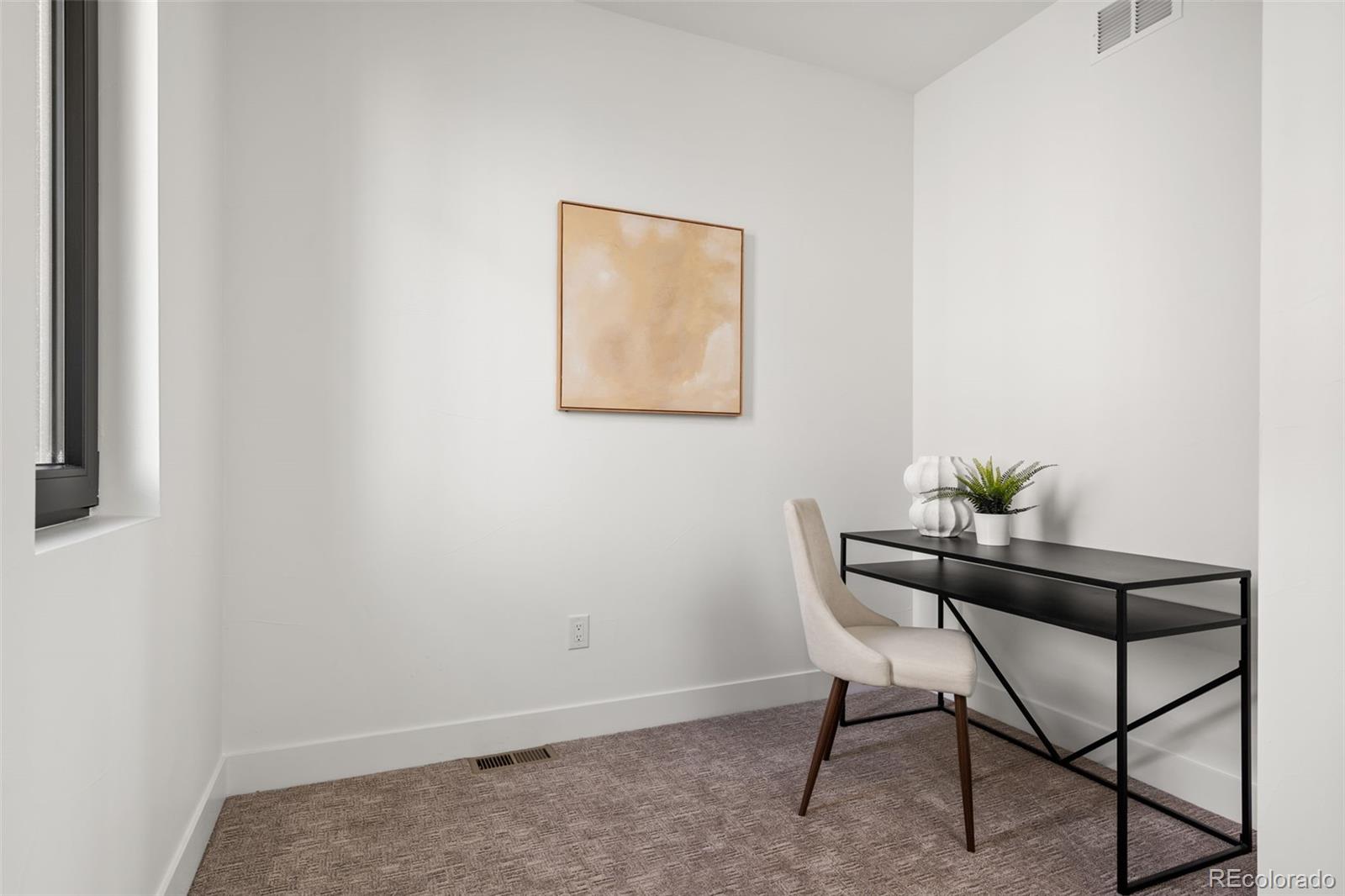1256 Yates Street Denver, CO 80204 - Photo 18 of 26 a dining room with furniture and a potted plant