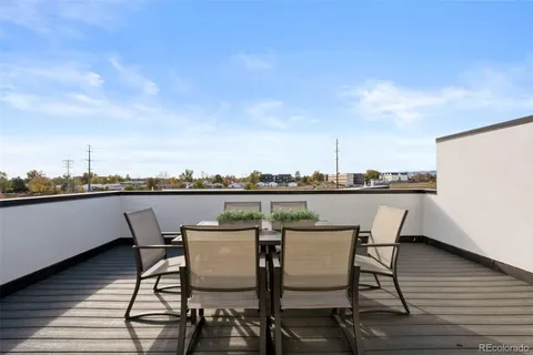 a view of a terrace with furniture and stove