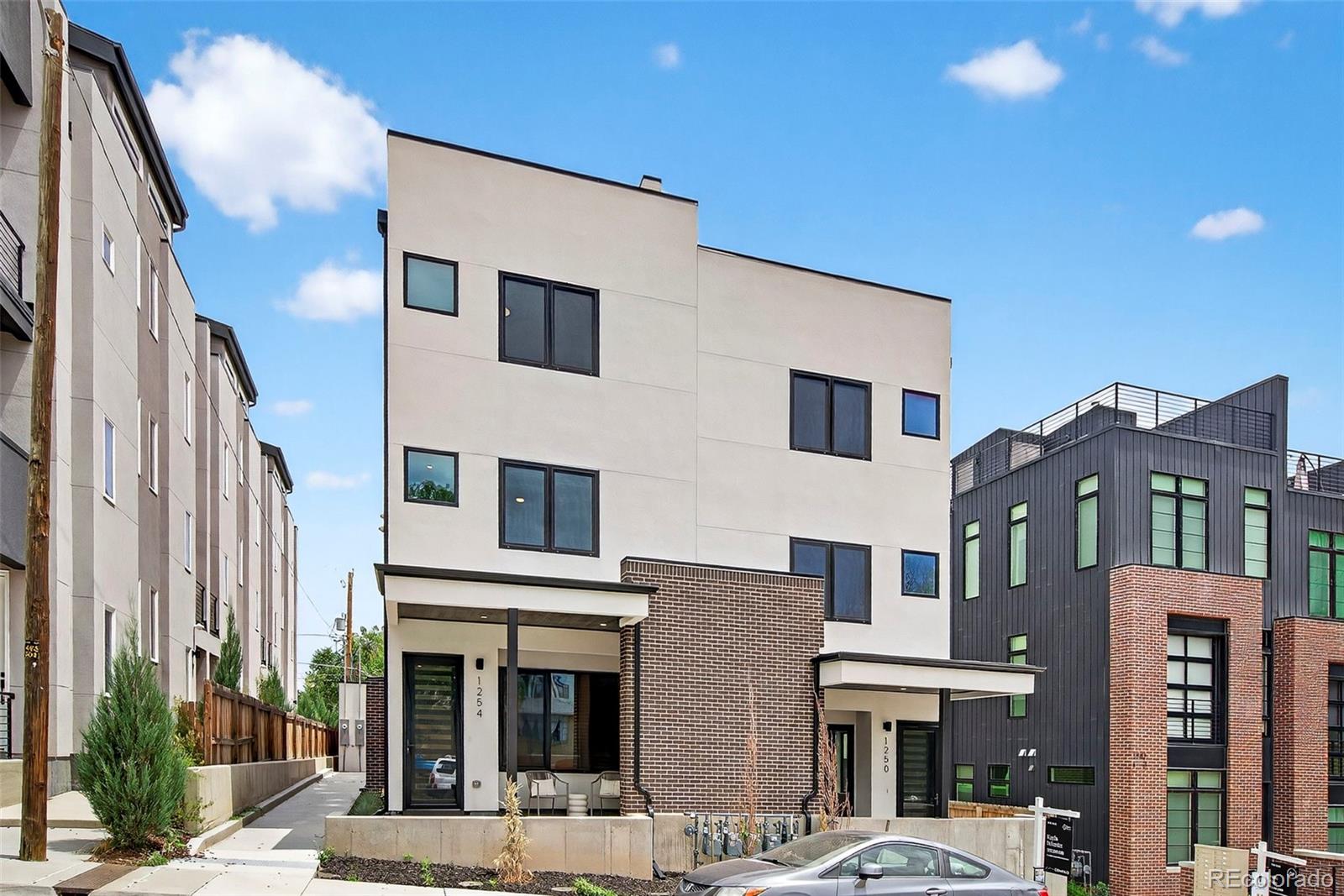 1256 Yates Street Denver, CO 80204 - Photo 25 of 26 a front view of a multi story residential apartment building