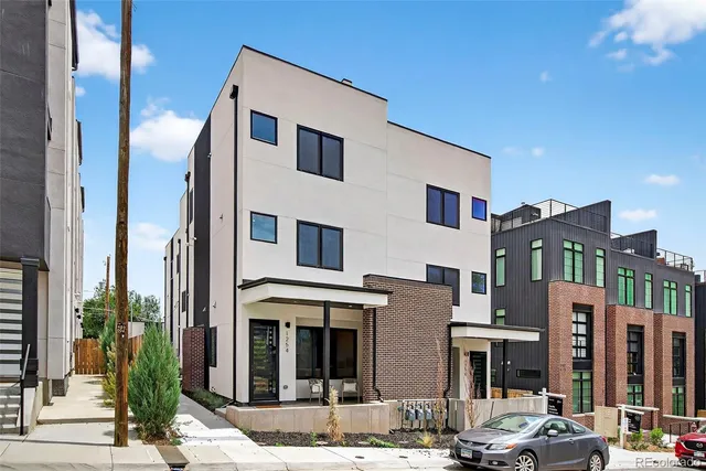 a front view of a building with street view