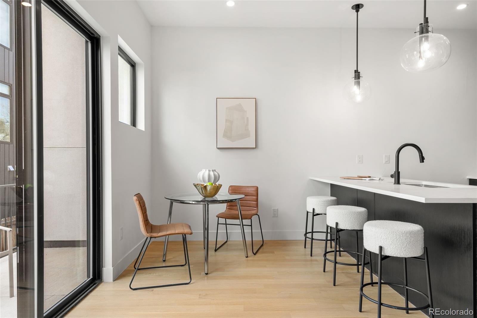 1256 Yates Street Denver, CO 80204 - Photo 6 of 26 a dining room with furniture and window