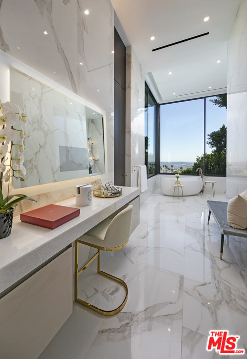 9364 Beverlycrest Drive Beverly Hills, CA 90210 - Photo 13 of 18 a lobby with a table chairs and couches with kitchen view