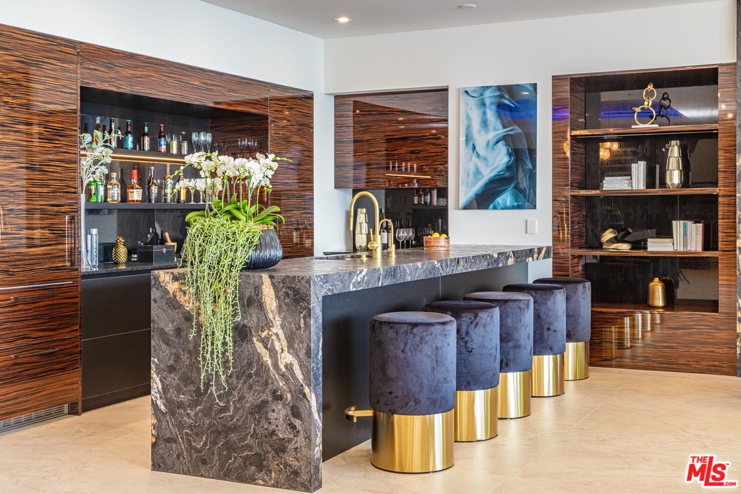 9364 Beverlycrest Drive Beverly Hills, CA 90210 - Photo 15 of 18 a living room with fireplace furniture and a potted plant