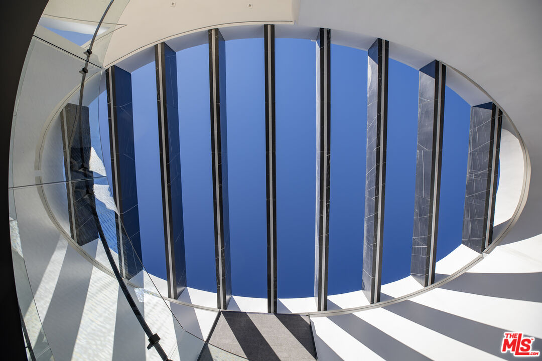 9364 Beverlycrest Drive Beverly Hills, CA 90210 - Photo 8 of 18 a view of a bedroom with wooden floor and stairs