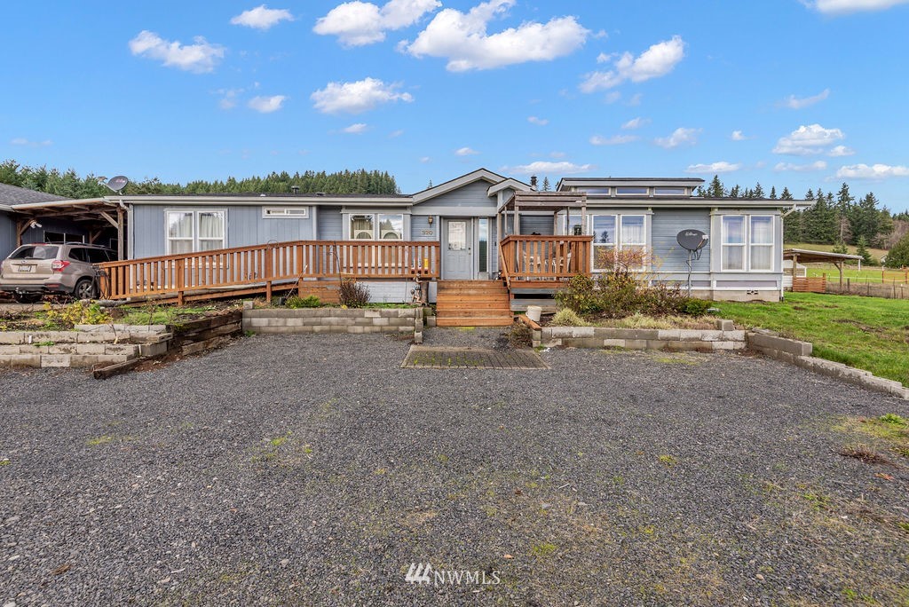 320 Sears Road Winlock, WA 98596 - Photo 1 of 26 a view of a house with backyard and sitting area