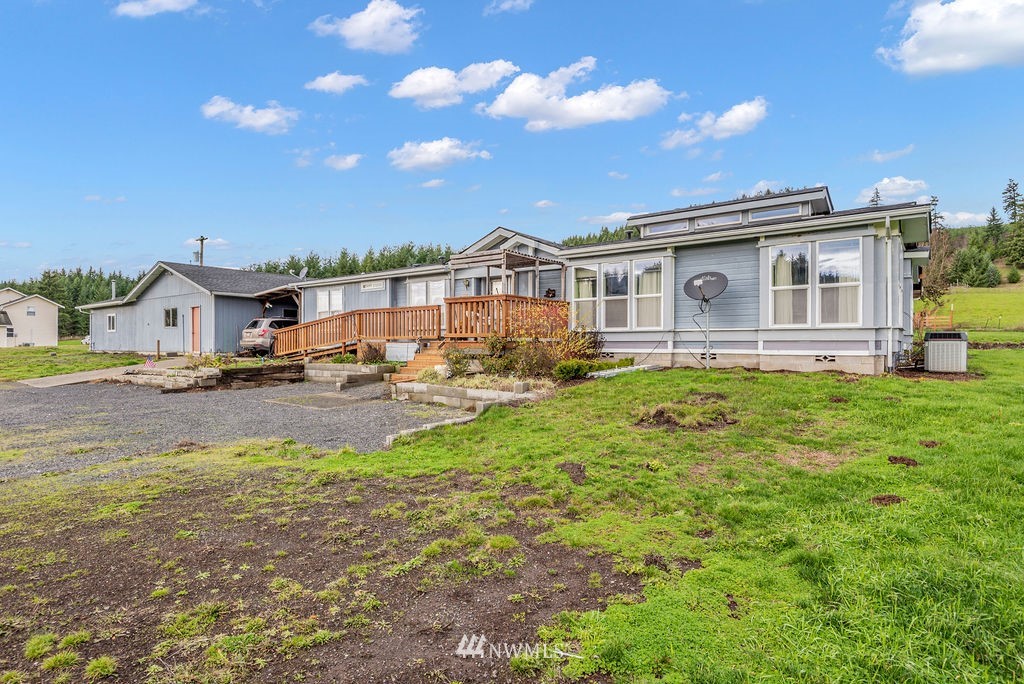 320 Sears Road Winlock, WA 98596 - Photo 2 of 26 a front view of a house with garden