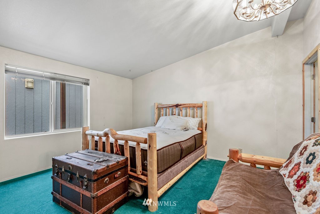 320 Sears Road Winlock, WA 98596 - Photo 14 of 26 a bedroom with a bed and a window