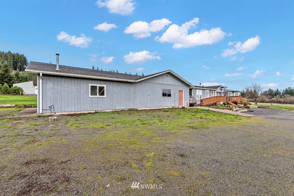 320 Sears Road Winlock, WA 98596 - Photo 24 of 26 a view of outdoor kitchen with seating area and barbeque oven