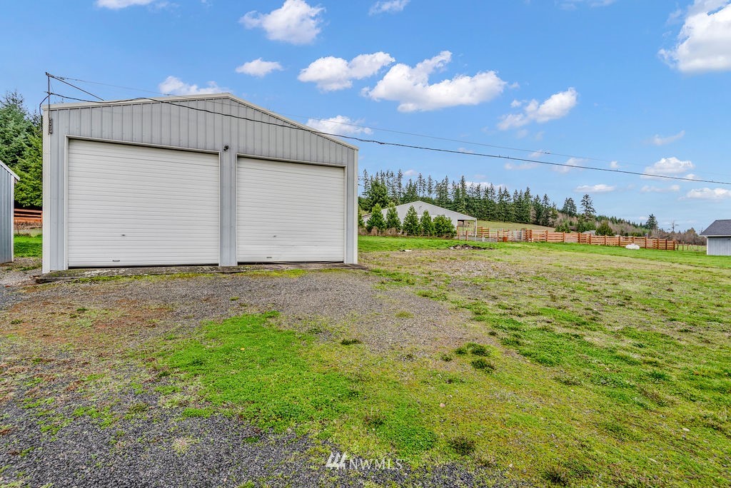 320 Sears Road Winlock, WA 98596 - Photo 25 of 26 a view of a big room with a big yard and large tree