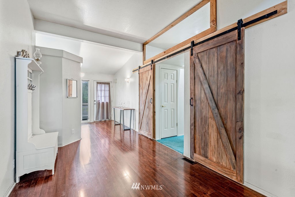 320 Sears Road Winlock, WA 98596 - Photo 4 of 26 a view of entryway with wooden floor and stairs