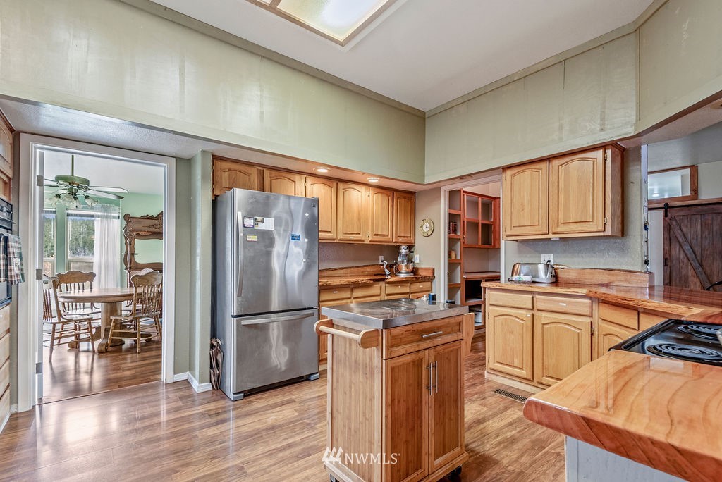 320 Sears Road Winlock, WA 98596 - Photo 7 of 26 a kitchen with stainless steel appliances granite countertop a refrigerator stove top oven and sink