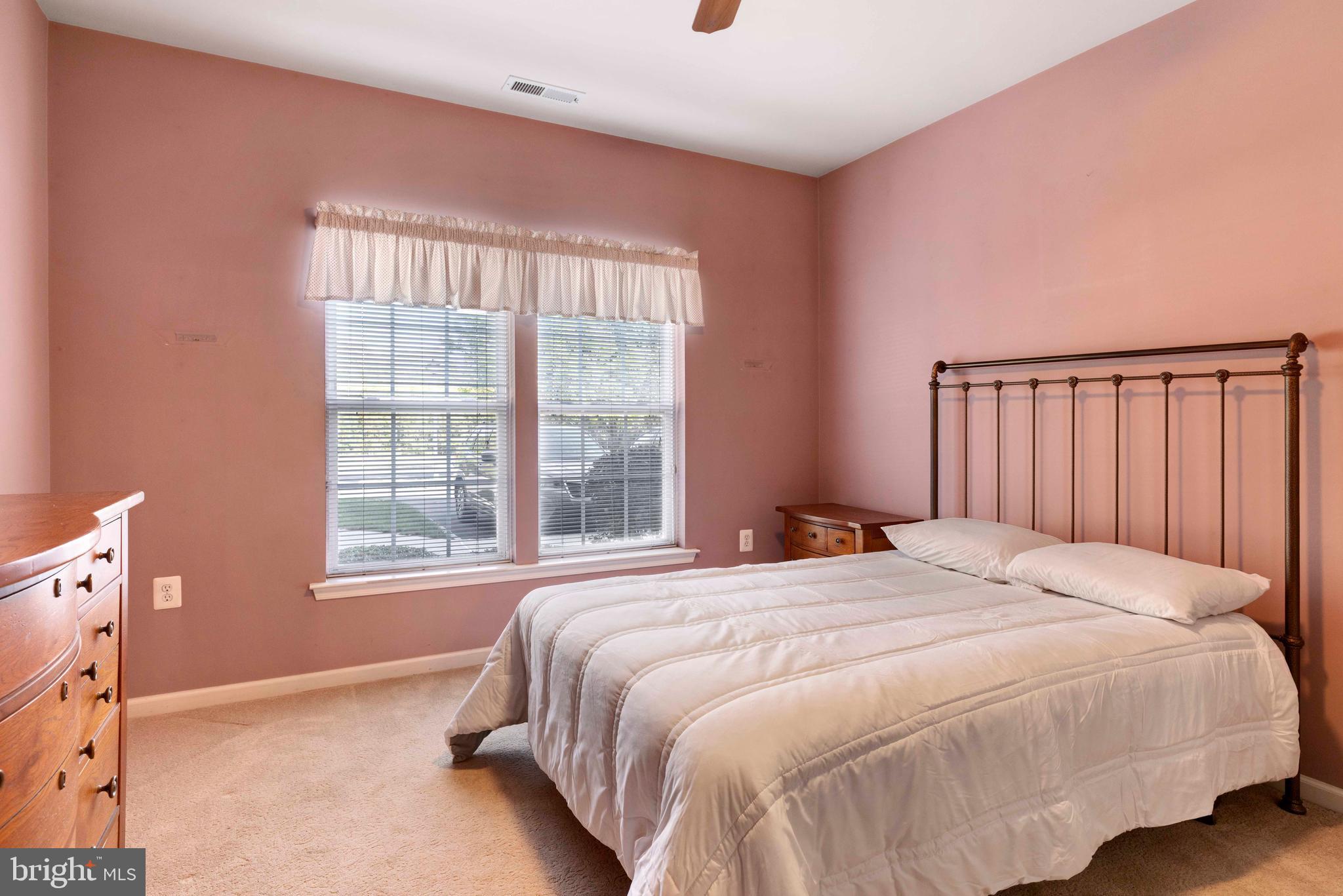 100 Fiddleleaf Lane, Unit 104 Warrington, PA 18976 - Photo 13 of 20 a bedroom with a bed and a window