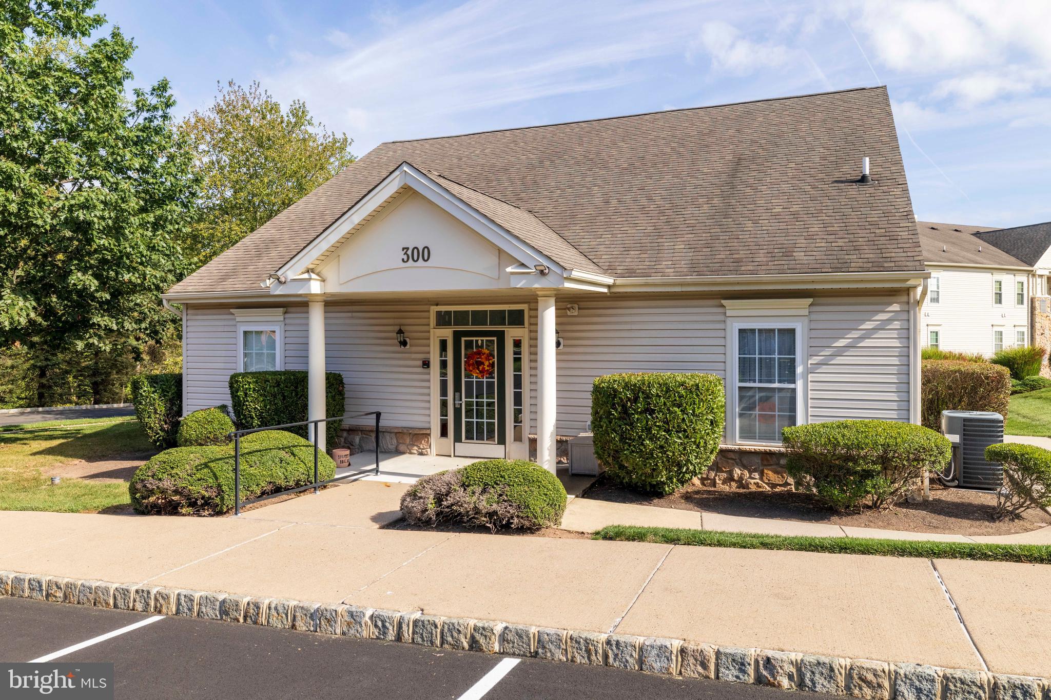 100 Fiddleleaf Lane, Unit 104 Warrington, PA 18976 - Photo 19 of 20 a front view of a house with garden