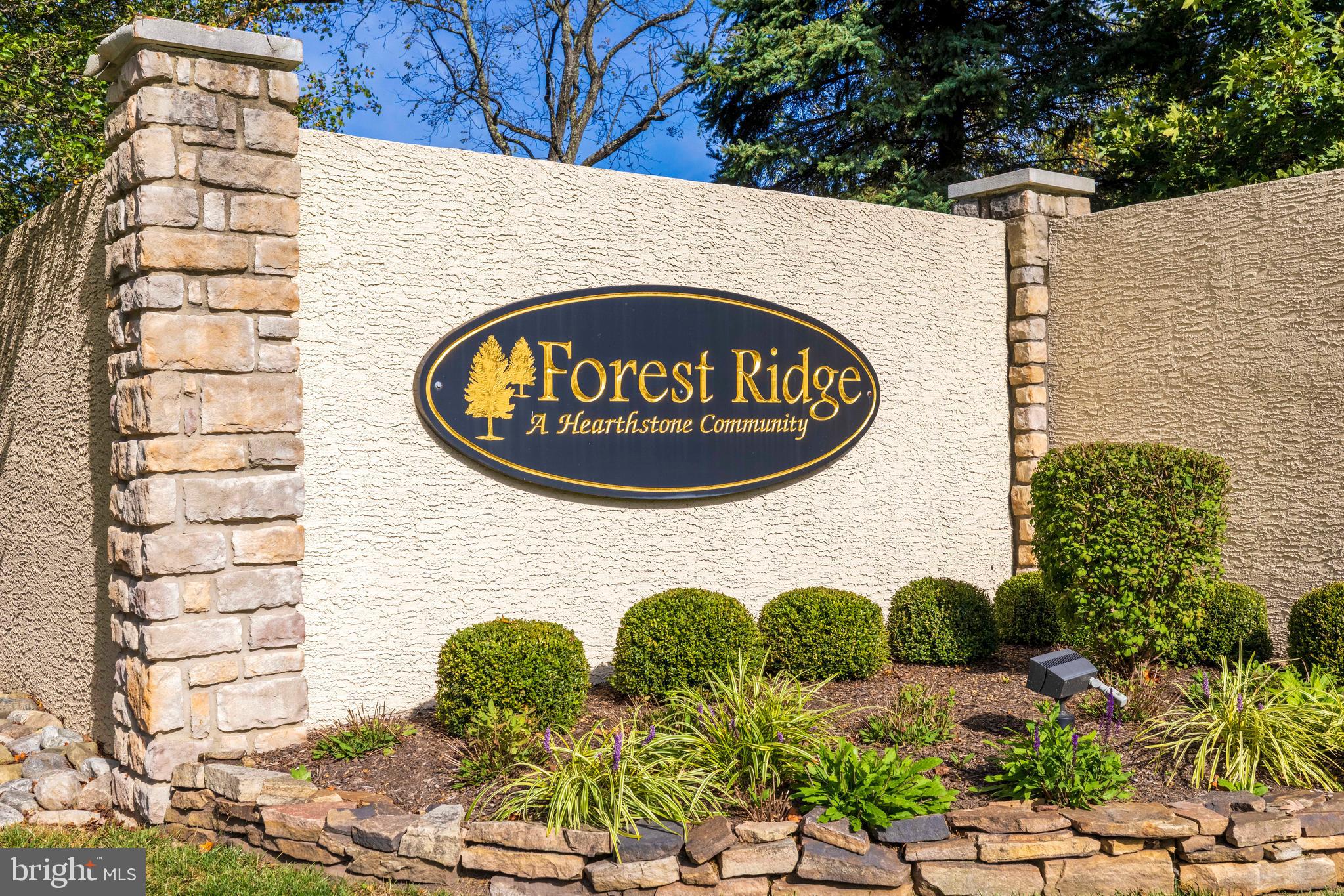 100 Fiddleleaf Lane, Unit 104 Warrington, PA 18976 - Photo 2 of 20 a sign that is on the side of a brick building