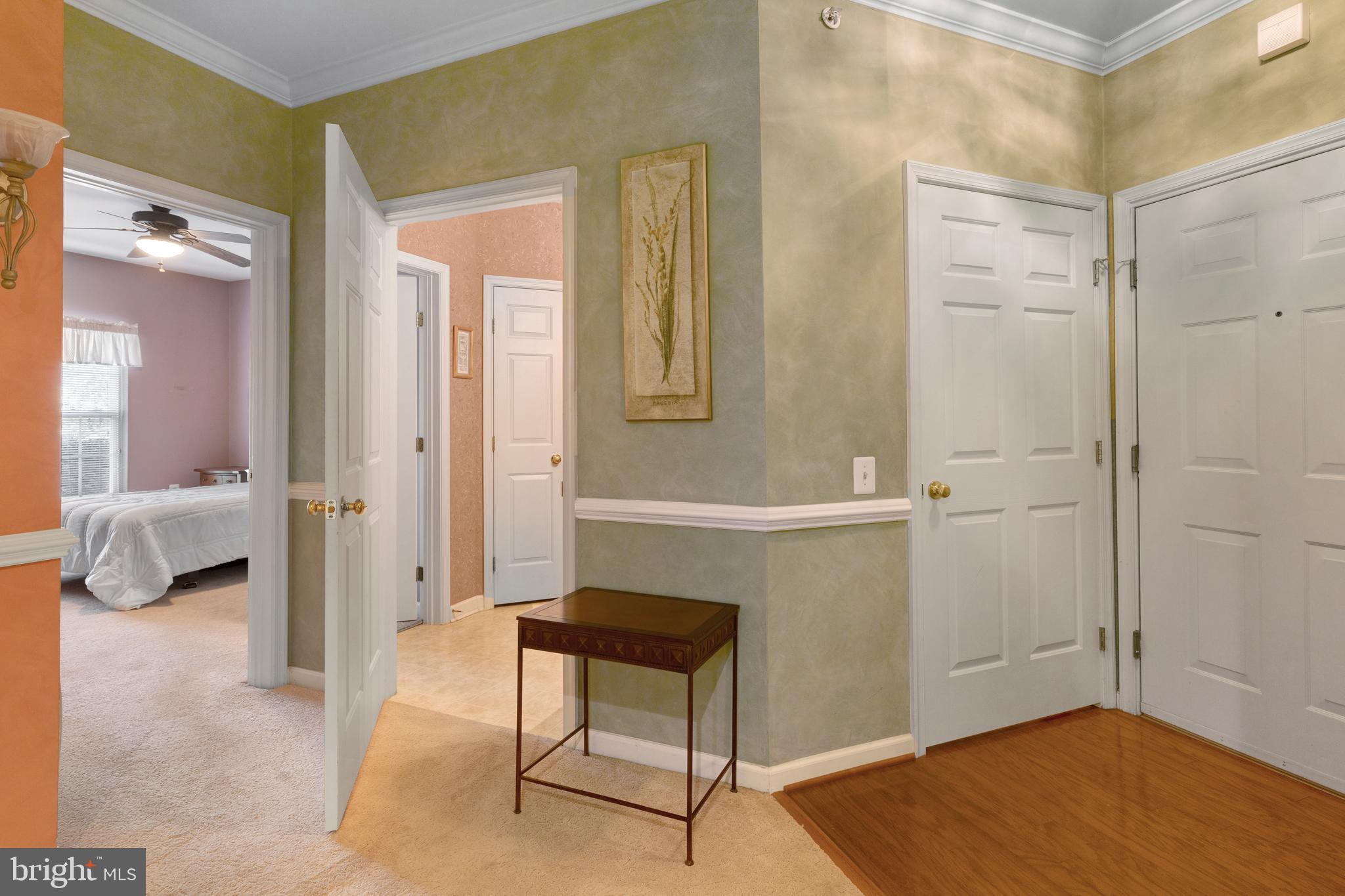 100 Fiddleleaf Lane, Unit 104 Warrington, PA 18976 - Photo 3 of 20 a view of a livingroom with couch and cabinet