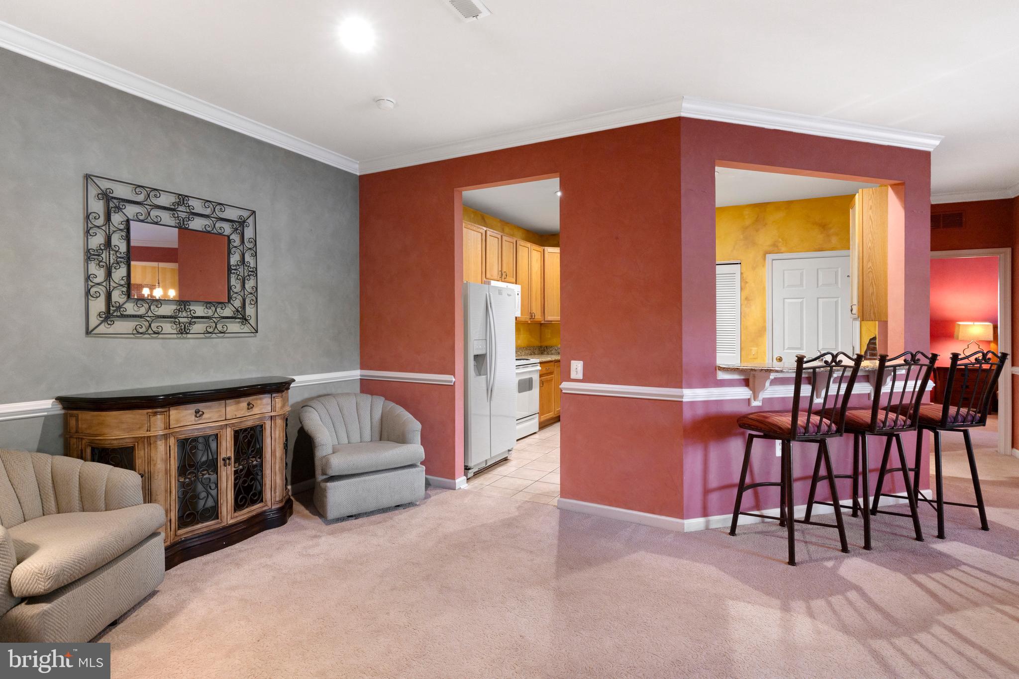 100 Fiddleleaf Lane, Unit 104 Warrington, PA 18976 - Photo 4 of 20 a living room with furniture and a dining table