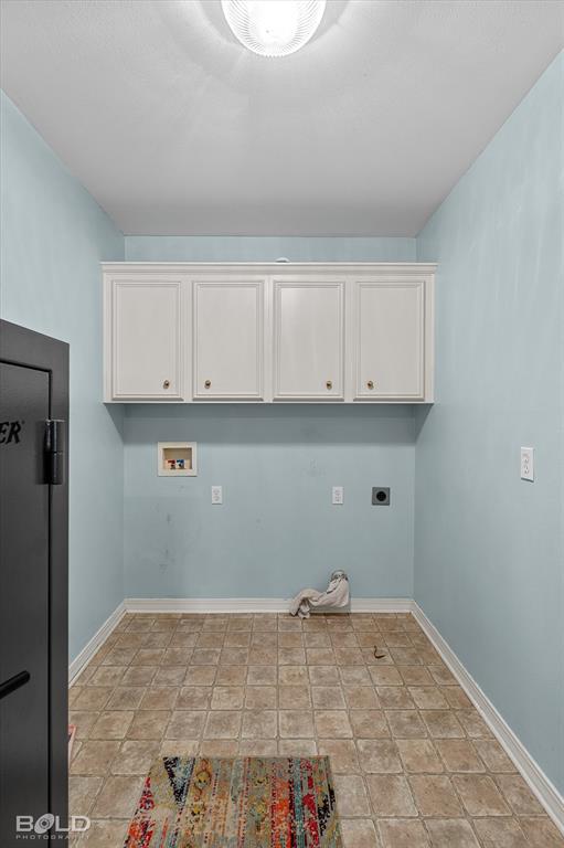 136 Scarborough Road Benton, LA 71006 - Photo 25 of 32 Utility room with light blue walls, white upper cabinetry, and square tile-patterned flooring