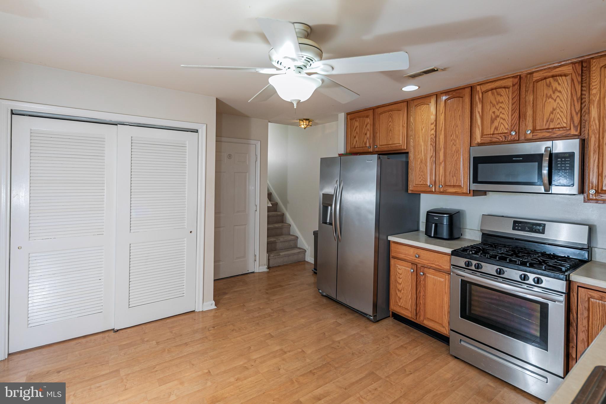 163 Federal Point Boulevard Lawrence Township, NJ 08648 - Photo 15 of 37 a kitchen with stainless steel appliances a refrigerator stove and microwave