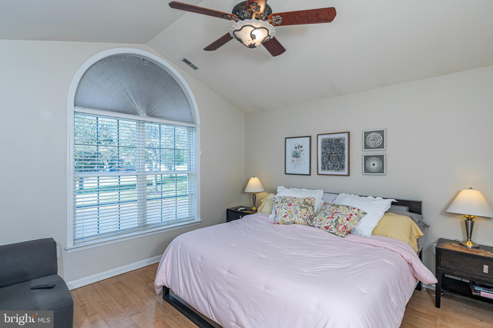 163 Federal Point Boulevard Lawrence Township, NJ 08648 - Photo 17 of 37 a bedroom with a bed and a chandelier