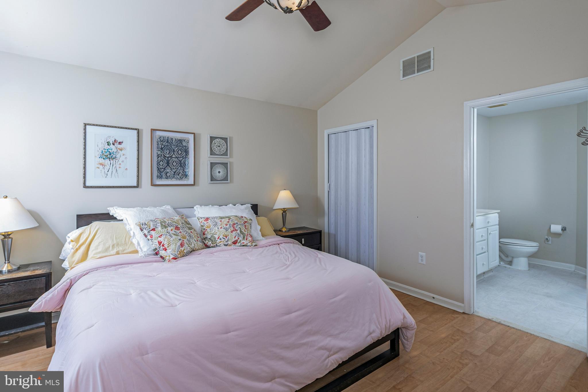 163 Federal Point Boulevard Lawrence Township, NJ 08648 - Photo 18 of 37 a bedroom with a bed and painting on the wall