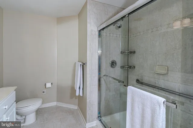 a bathroom with a toilet sink and shower