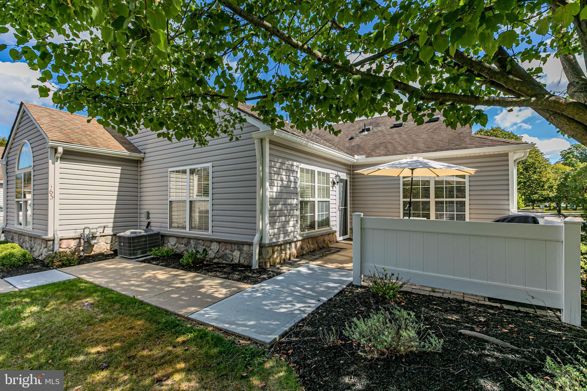 163 Federal Point Boulevard Lawrence Township, NJ 08648 - Photo 2 of 37 a view of house with backyard and glass windows