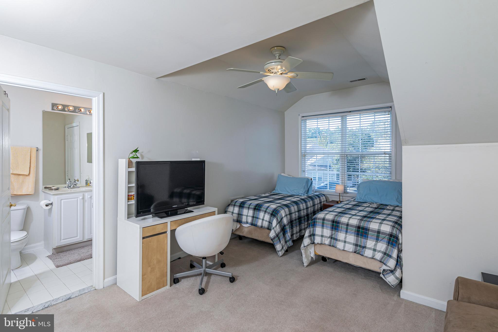 163 Federal Point Boulevard Lawrence Township, NJ 08648 - Photo 25 of 37 a bedroom with a bed and a chandelier