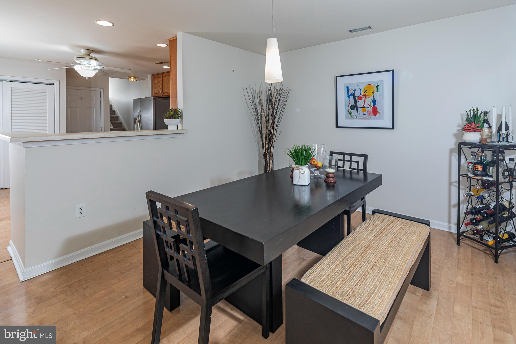 163 Federal Point Boulevard Lawrence Township, NJ 08648 - Photo 9 of 37 a view of a dining room with furniture and wooden floor