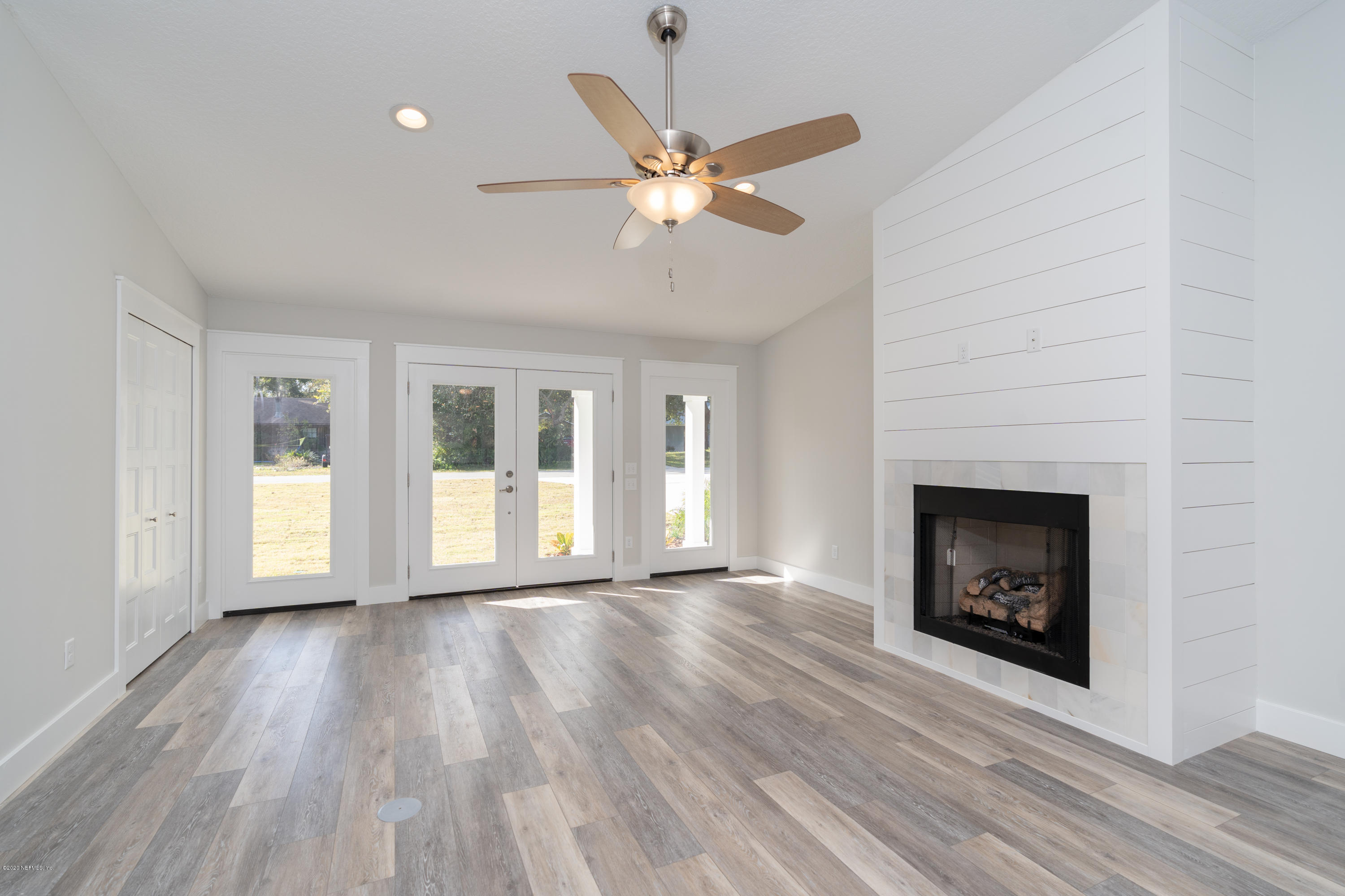 30 Fireplace in living room with entranc