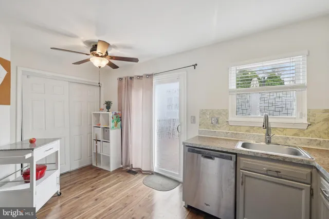 a workspace with furniture and white wooden floor