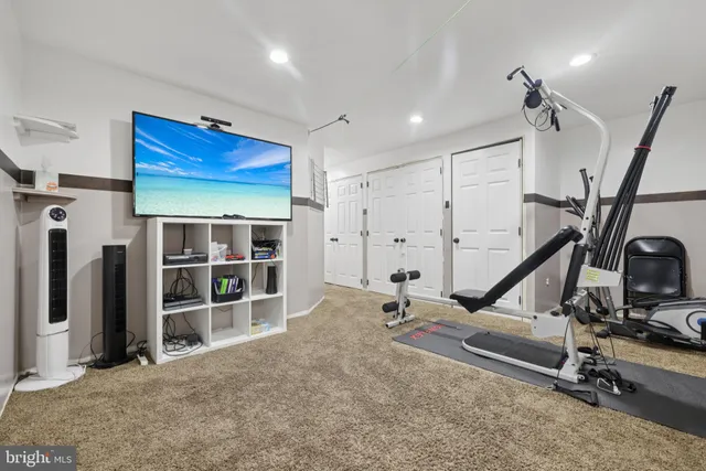 a view of a room with wooden floor and cabinet