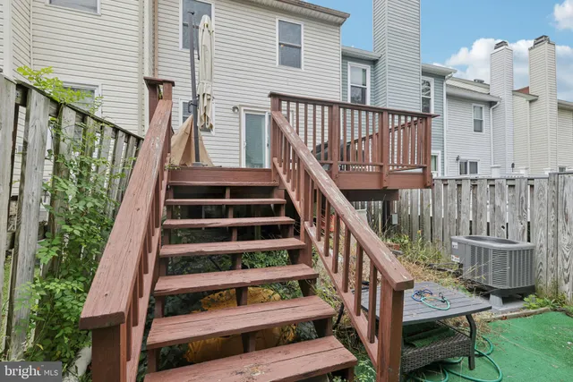 a balcony with table and chairs