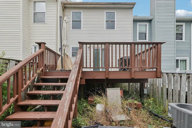 a view of entryway with wooden floor and stairs